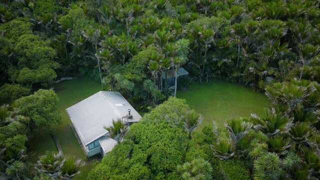 Aerial: House nestled in the bush, Anawhata, New Zealand