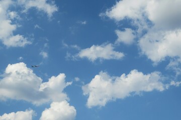 Beautiful white fluffy clouds in blue sky background