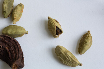 Black and green cardamom pods, a popular spice in traditional Indian cuisine and also in many other cultures
top down