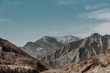 Alpine range on horizon. Structure of rocks with stones on slope. Silhouette of mountain line. Plan to reach top for relaxation, trail in highlands.