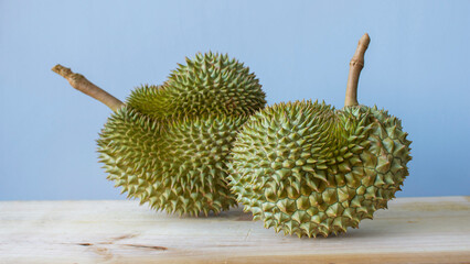 Durian placed on a wooden table in the morning - 506540597
