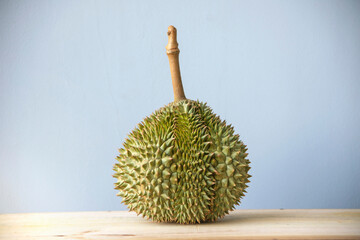 Durian served on a wooden table - 506540598