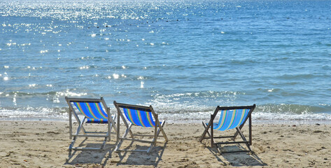 Three Beach Chairs at Sunset