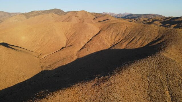 Dawn aerial shot of some remote desert mountains in California near the Nevada border