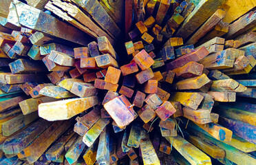 several piles of wood for building materials, colorful wood pile textures, colorful wood textures