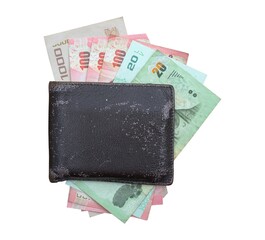 Old leather wallet with banknote on whtie background