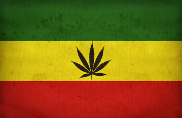 Rasta flag with a marijuana leaf on fabric texture,retro vintage style