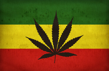Rasta flag with a marijuana leaf on fabric texture,retro vintage style