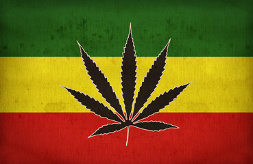 Rasta flag with a marijuana leaf on fabric texture,retro vintage style