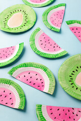 Fruit made of paper - watermelon. Blue background. Tropics creative concept, kindergarten, daycare...