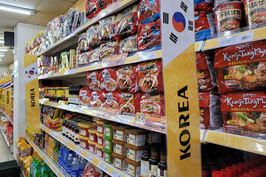 PENANG, MALAYSIA - 12 APR 2022: Interior view of various imported foods and products from Korea in Sunshine Grocery store, Penang. Selective focus image.