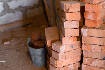 Red ceramic bricks stacked in towers