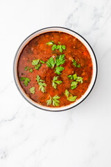 healthy plant-based food, vegan mexican-inspired spicy tomato soup with red kidney beans corn and coriander