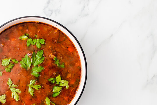 healthy plant-based food, vegan mexican-inspired spicy tomato soup with red kidney beans corn and coriander