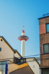 The Kyoto Tower between residential buildings, Kyoto, Japan