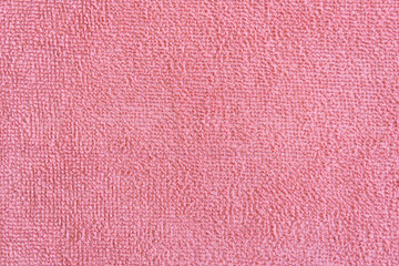 close up light pink microfiber texture. Cleaning rag fluffy cloth