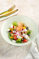 Plate of salad on light grey concrete background