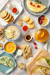 Overhead view of breakfast on light grey background