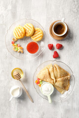 Overhead view of breakfast on light grey background