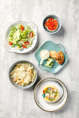 Overhead view of food on light grey concrete background