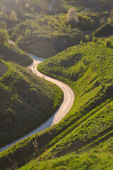 Poland, Grodzisko Stradów. Beautiful landscape, winding street, road. Countryside, outside the city. Fields and meadows.