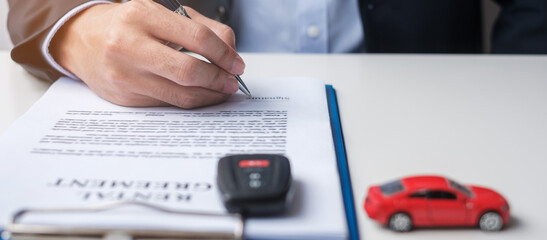 Businessman signing contract document. Rental contract, insurance, and contract agreement concepts