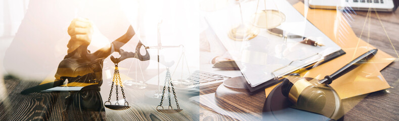 Justice and law concept.Male judge in a courtroom with the gavel, working with, computer and docking keyboard, eyeglasses, on table in morning light
