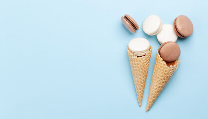 Various macaroon cookies in ice cream cones