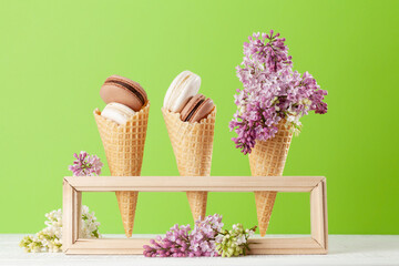 Various macaroon cookies in ice cream cones