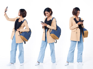 Obraz premium Full length of Asian Indian 20s working woman with curl hair hold cell smart phone backpack blazzer