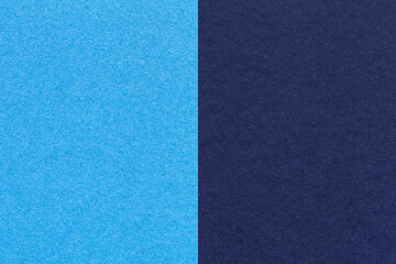 Fototapeta premium Texture of craft navy blue and turquoise paper background, half two colors, macro. Structure of vintage cardboard.