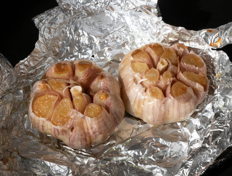 Two whole heads garlic right out of the oven. Golden roasted garlic cloves