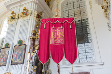 Red standard with the monogram of Jesus 