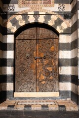 historic, wooden door and oriental architecture in old city of damascus, Syria