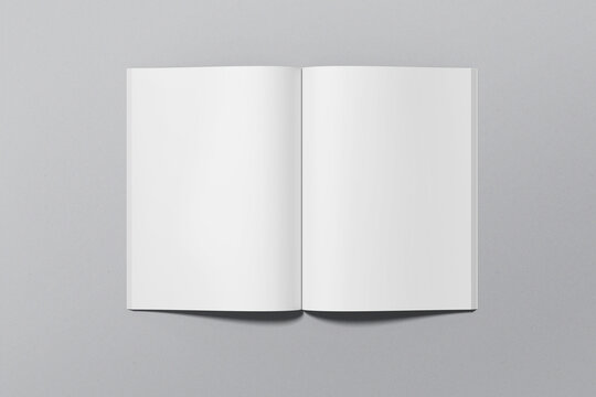 A4 magazine mockup top view, book or catalog on gray table. Blank page or notepad on solid background. Blank page or notepad for mockups or simulations.