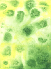 Fototapeta na wymiar beautiful unusual green watercolor background with stains and yellow spots
