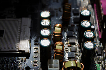 Old capacitors and inductors on the motherboard. Socket 754.