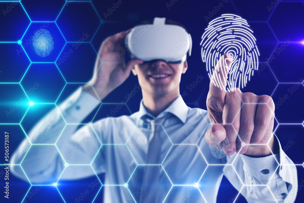 Poster attractive young european man with vr glasses on blue background with digital thumb print biometrics