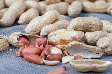 group of roasted peanuts in the shell without salt