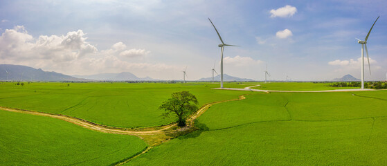 PANORAMIC VIEW OF WIND FARM OR WIND PARK, WITH HIGH WIND TURBINES FOR GENERATION ELECTRICITY WITH...