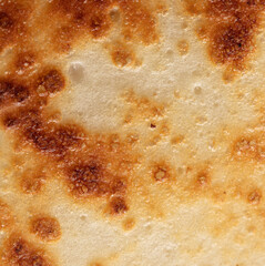 Pan fried pancake as a background.