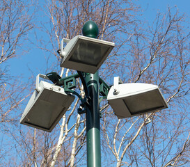 Lantern on a metal pole in the city during