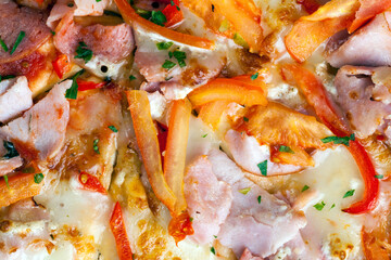 pizza with different ingredients pepper, cheese, sausage and green spices