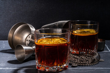 Hard alcohol drink with orange slice garnish. Negroni cocktail with dried orange and whiskey, copy space