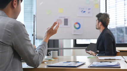 Start up business people brainstorming and discussing about marketing strategy plan at meeting