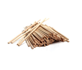 Several pieces of rattan sticks are placed on a white background.