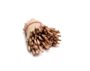 Several pieces of rattan sticks are placed on a white background.