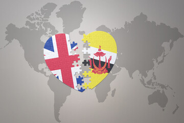 puzzle heart with the national flag of brunei and great britain on a world map background. Concept.