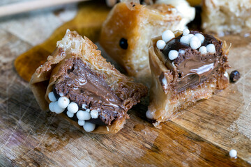 sweets made of thin puff pastry with chocolate filling and honey
