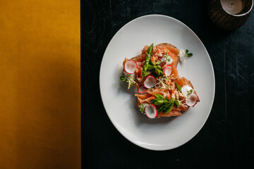 Healthy Seafood Sandwich with crab and radish vegetables  on white plate in diner restaurant furniture